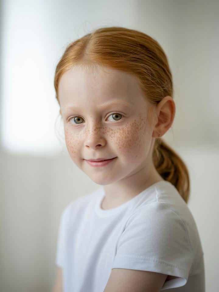 Rosie — AI child model: Red hair ponytail, freckles, classic look